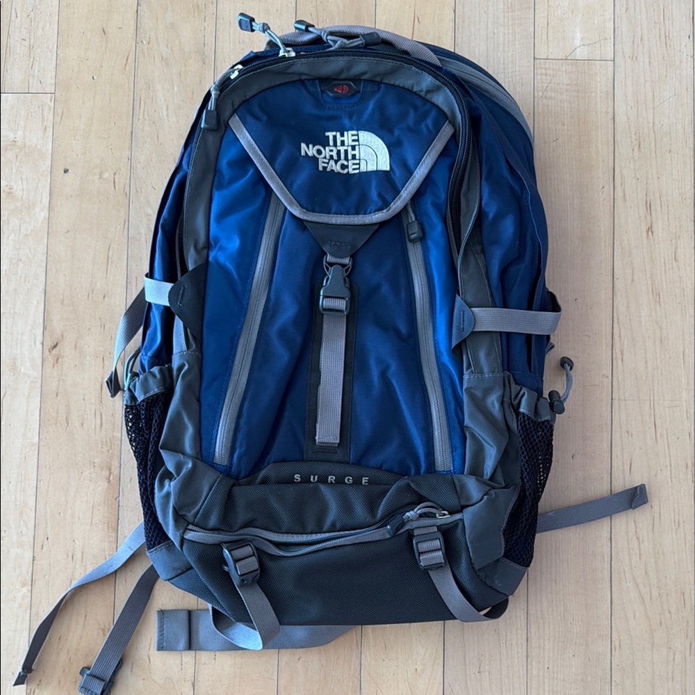 The North Face Blue and Gray Backpack with Multiple Compartments